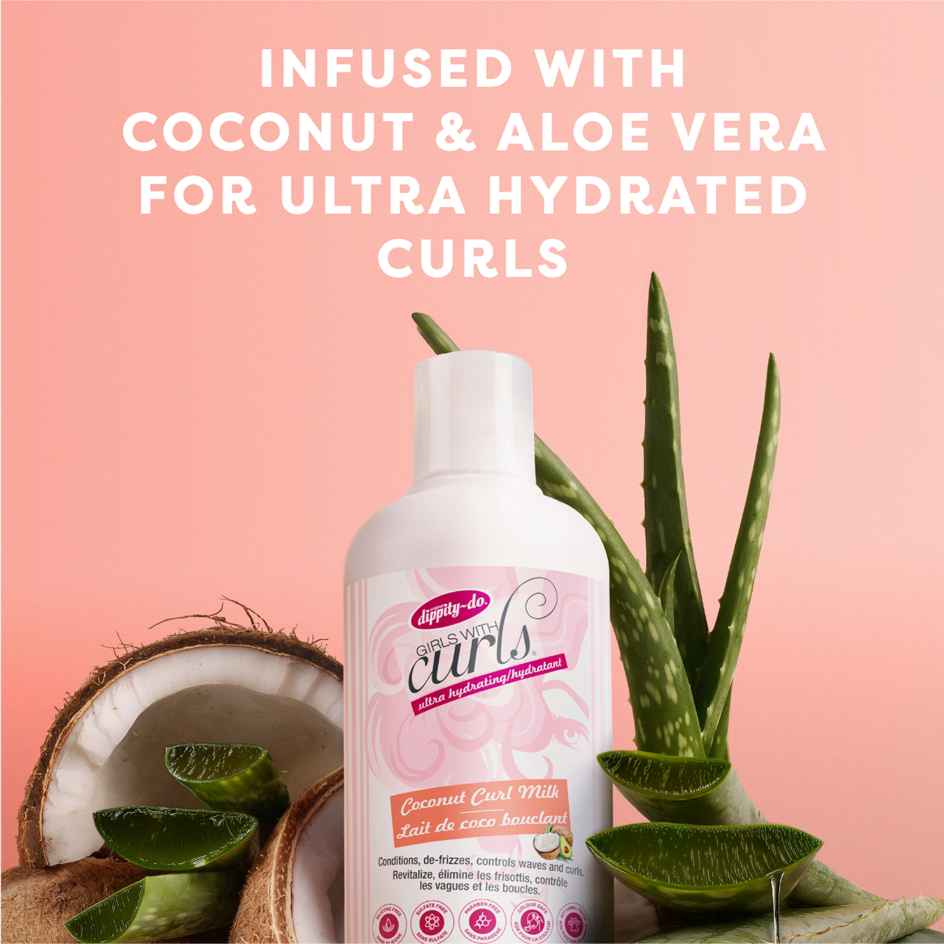 Coconut Curl Milk bottle with coconut and aloe vera on a pink background